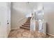 A bright two-story foyer features tile flooring and staircase to the upper level at 304 Jolly January Ave, Las Vegas, NV 89183