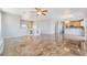Open-concept living area showcasing glossy tile flooring, a glimpse of the kitchen, and an airy ambiance at 304 Jolly January Ave, Las Vegas, NV 89183