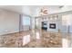 Expansive living room with glossy tile flooring, fireplace and large windows for plenty of natural light at 304 Jolly January Ave, Las Vegas, NV 89183
