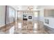 Spacious living area with a fireplace, complemented by glossy tile floors and bright windows at 304 Jolly January Ave, Las Vegas, NV 89183