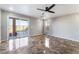 Bright living room with a ceiling fan, a sliding glass door with a backyard pool view at 304 Jolly January Ave, Las Vegas, NV 89183