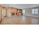 Living room with a brick fireplace, tile flooring, and a built-in bar at 3070 Breton Dr, Las Vegas, NV 89108