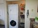 Practical laundry area including a washer, dryer, and storage shelves at 3550 Bay Sands Dr # 3056, Laughlin, NV 89029