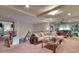 Upstairs living room with neutral tones, carpet, and multiple seating areas at 3784 Cheryl Lynne Ct, Las Vegas, NV 89139