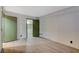 Spacious bedroom featuring light wood floors, closet, and ensuite bathroom at 4140 Gannet Cir # 255, Las Vegas, NV 89103
