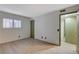 Bright bedroom with light-colored wood floors and ensuite bathroom access at 4140 Gannet Cir # 255, Las Vegas, NV 89103