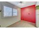 Bright dining area featuring a large window with shutters and an accent wall at 4140 Gannet Cir # 255, Las Vegas, NV 89103