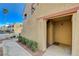 Exterior entrance of the condo unit displaying the unit number with well-kept desert landscaping at 4140 Gannet Cir # 255, Las Vegas, NV 89103