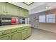 Kitchen view showing tile counters and bright green cabinets at 4140 Gannet Cir # 255, Las Vegas, NV 89103