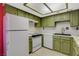 Efficient kitchen with white appliances and bright green cabinets at 4140 Gannet Cir # 255, Las Vegas, NV 89103