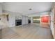 Bright living space featuring light-colored flooring, fireplace, and mirrored wall accents at 4140 Gannet Cir # 255, Las Vegas, NV 89103