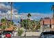 Charming neighborhood street with well-maintained houses and lush landscaping under a bright, partly cloudy sky at 4140 Gannet Cir # 255, Las Vegas, NV 89103