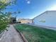 Green backyard with block wall in a residential property at 4194 Greenpoint St, Las Vegas, NV 89147