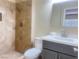 Updated bathroom featuring tiled shower and vanity at 4194 Greenpoint St, Las Vegas, NV 89147