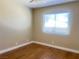 Bedroom with wood floors and large window providing ample natural light at 4194 Greenpoint St, Las Vegas, NV 89147