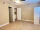Bedroom with light tile flooring, ceiling fan, and closet at 4194 Greenpoint St, Las Vegas, NV 89147