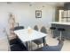 Open concept: dining area leading to a modern kitchen, creating an inviting space at 4194 Greenpoint St, Las Vegas, NV 89147