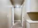 Hallway featuring a light, neutral color palette with tile floors at 4194 Greenpoint St, Las Vegas, NV 89147