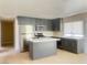 Kitchen with grey cabinets, quartz counters, and stainless steel appliances at 4194 Greenpoint St, Las Vegas, NV 89147