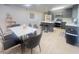 Modern kitchen features stainless steel appliances, island with seating, and gray cabinets at 4194 Greenpoint St, Las Vegas, NV 89147