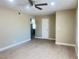 Open living room with hardwood floors and a ceiling fan at 4194 Greenpoint St, Las Vegas, NV 89147