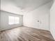 Sunny bedroom with a ceiling fan and a large window with modern vinyl floors at 45 Maleena Mesa St # 327, Henderson, NV 89074