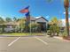 Landscaped view of the community clubhouse, including a parking area and the American flag at 45 Maleena Mesa St # 327, Henderson, NV 89074