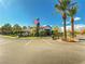 Manicured view of the community clubhouse and the parking area from across the street at 45 Maleena Mesa St # 327, Henderson, NV 89074