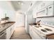 Functional kitchen design with white appliances, plenty of counter space, and ample cabinet storage at 45 Maleena Mesa St # 327, Henderson, NV 89074