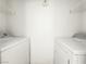 Functional laundry room with washer, dryer, and shelving at 45 Maleena Mesa St # 327, Henderson, NV 89074
