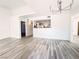 Bright living room featuring open concept layout with eat-in kitchen and contemporary light fixture at 45 Maleena Mesa St # 327, Henderson, NV 89074