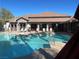 Inviting community pool with lounge seating and covered seating areas around it at 45 Maleena Mesa St # 327, Henderson, NV 89074