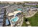 Stunning aerial view of the community featuring a pool, tennis courts, and clubhouse at 4743 S Sungold St, Pahrump, NV 89061