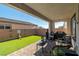 Relaxing backyard with covered patio and manicured artificial turf at 4743 S Sungold St, Pahrump, NV 89061