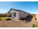 Fully-fenced backyard with covered patio and rock landscaping at 4743 S Sungold St, Pahrump, NV 89061