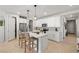 Bright kitchen featuring a center island with seating, stainless steel appliances, and ample cabinet space at 4743 S Sungold St, Pahrump, NV 89061