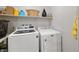 Laundry room with modern white washer and dryer at 4743 S Sungold St, Pahrump, NV 89061