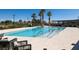 Resort style pool and lounge area, featuring a pool with accessibility and sunny patio area at 4743 S Sungold St, Pahrump, NV 89061