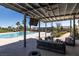 Beautiful poolside lounge area complete with patio furniture, perfect for relaxation and entertainment at 4743 S Sungold St, Pahrump, NV 89061