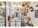 Cluttered bathroom with vanity, mirror, and shower, decorated with unique personal touches and art at 4960 Harrison Dr # 131, Las Vegas, NV 89120