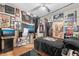Eclectic bedroom with unique decor, including posters and memorabilia adorning the walls for a personalized touch at 4960 Harrison Dr # 131, Las Vegas, NV 89120