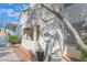 Condo exterior showing second story access, blue trim, and maintained landscape at 4960 Harrison Dr # 131, Las Vegas, NV 89120