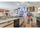 Functional kitchen features laminate counters, white cabinets, and appliances at 4960 Harrison Dr # 131, Las Vegas, NV 89120