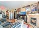 Comfortable living room features a fireplace, wood floors, and entertainment center at 4960 Harrison Dr # 131, Las Vegas, NV 89120