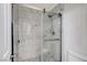 Beautiful walk-in shower with decorative tile and a glass door at 4977 Vacaville Ave, Las Vegas, NV 89139