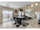 Open-concept dining area featuring a sliding glass door to the back patio at 4977 Vacaville Ave, Las Vegas, NV 89139