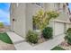 Landscaped front yard featuring desert landscaping and exterior facade at 4977 Vacaville Ave, Las Vegas, NV 89139
