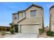 Charming two-story home featuring a two-car garage and neutral color palette at 4977 Vacaville Ave, Las Vegas, NV 89139