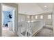 Second floor hallway with carpet flooring and a view of the lower level at 4977 Vacaville Ave, Las Vegas, NV 89139