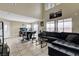 Bright living area featuring high ceilings, tiled flooring, and large windows at 4977 Vacaville Ave, Las Vegas, NV 89139